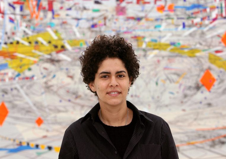 Ethiopian artist Julie Mehretu poses in front of her artwork at the Art club (Kunstverein) in Hanover, Germany, Thursday 08 February 2007. Her paintings ought to remind of satellites' images of the earth. The exhibition presents 18 large-sized works and v